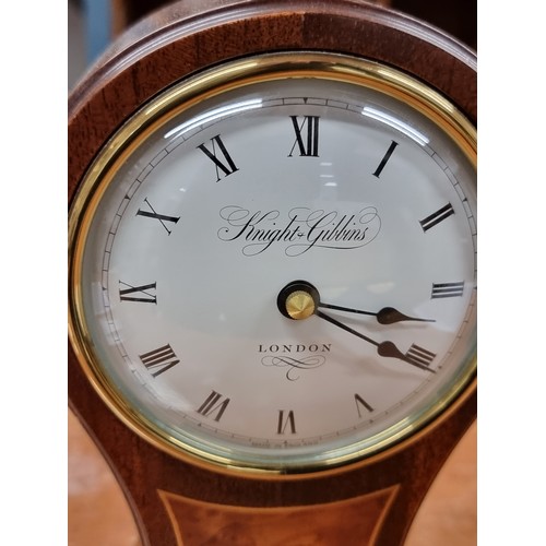 197 - A lovely Knight & Gibbins mantel clock. Of wonderful hourglass form with a solid wood case, convex g... 