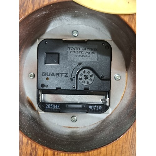 197 - A lovely Knight & Gibbins mantel clock. Of wonderful hourglass form with a solid wood case, convex g... 