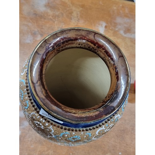199 - Star lot : An early 20th century very large Doulton Lambeth vase. A very ornate piece, richly decora... 