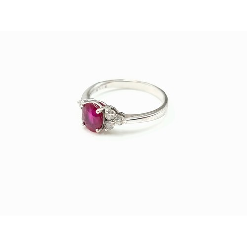 44 - Star Lot: An attractive 18 carat white gold ruby and diamond ring stamped 750 to band. Ruby fitted w... 