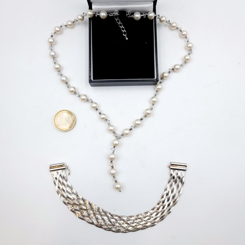 A fine drop pendant pearl necklace with gem set accents. Set with