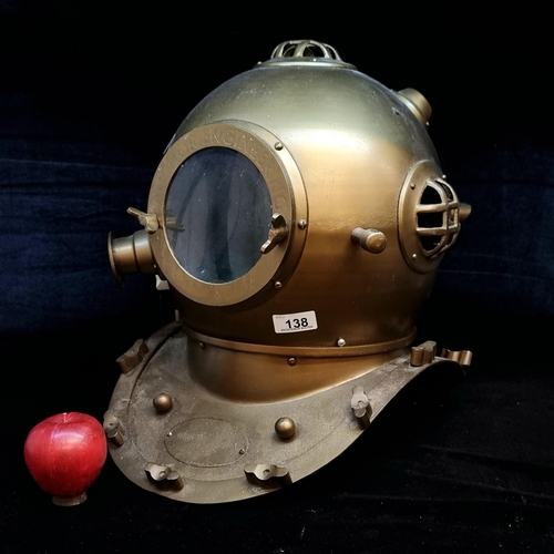 138 - Star Lot : A fabulous decorative only diver's helmet in a brass tone with glass face plate and grid.... 