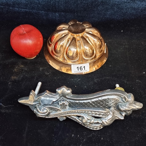 161 - Two Victorian style items. Including a vintage copper jelly mould. With an elaborate door knocker in... 