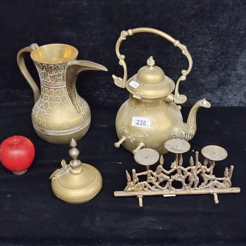 238 - A lot of four vintage brassware items including a spirit kettle, candle holder and a ewer. With inte... 