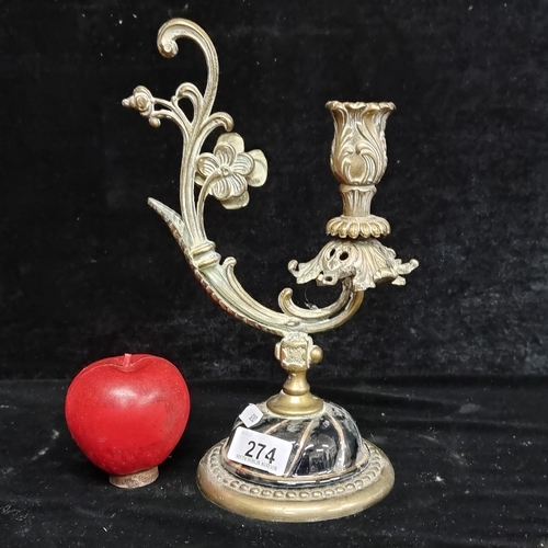 274 - A gorgeous, highly ornate brass candlestick with lavish foliate scroll detail and a ceramic base fin... 