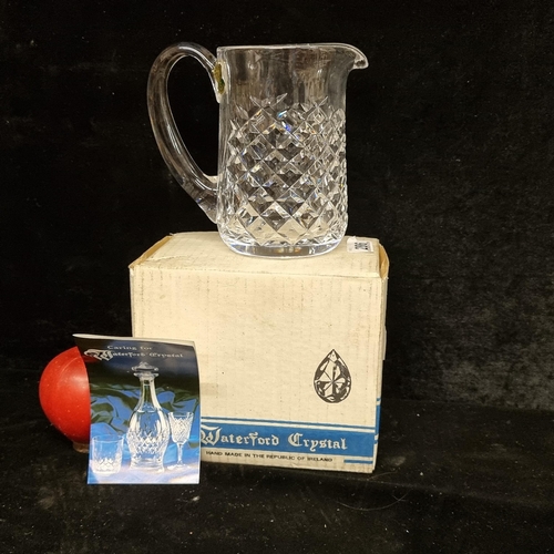 286 - A vintage Waterford Crystal jug in the 'Alana' pattern. Comes with the original box and retains the ... 