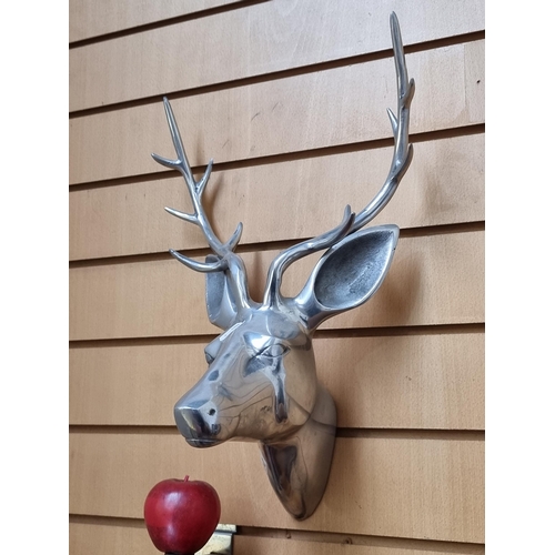 310 - A very cool and contemporary polished metal stag head, with  wonderful elongated antlers and hanging... 