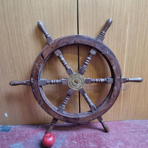 319 - A fabulous vintage ships steering wheel with six baluster shaped spokes joined by a central brass na... 