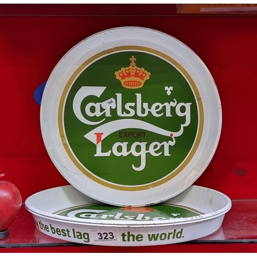 323 - Three Carlsberg branded metal drinks trays, reading 