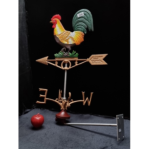 335 - An incredible and very heavy cast metal weather vane in the form of a traditional rooster in vibrant... 