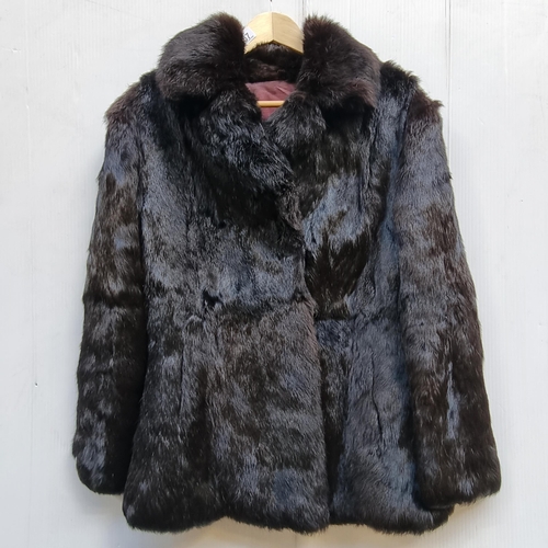 367 - A fabulous Coney fur ladies coat in a rich shade of dark brown with two external pockets and metal c... 