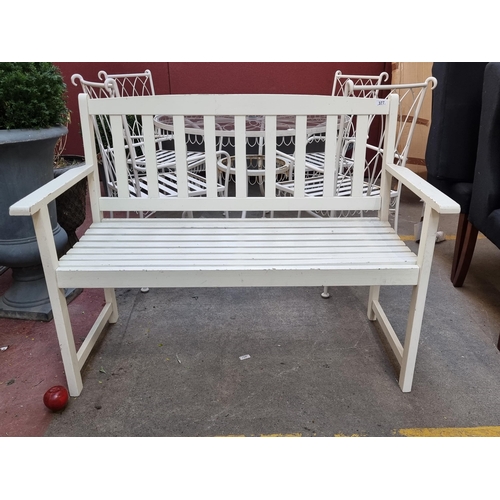 377 - A charming two seater wooden garden bench in a lovely matte cream finish. W120cm x H90cm.
The follow... 