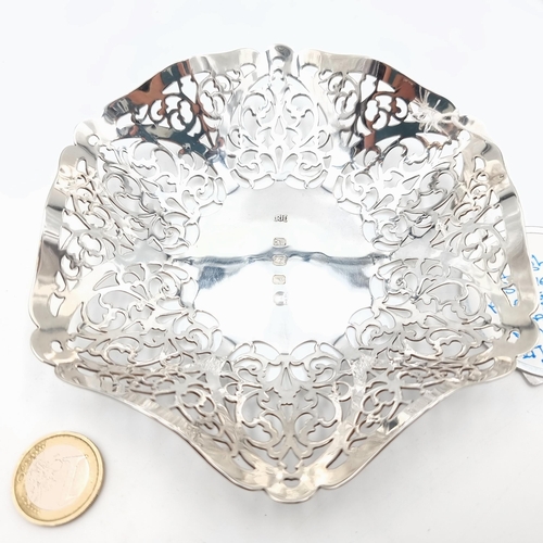 504 - A beautiful example of an Irish silver lattice design bonbon dish, this example features stunning fo... 
