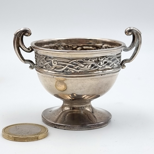 518 - A fine example of an antique sterling silver challenge cup, this cup features dual scroll handles an... 