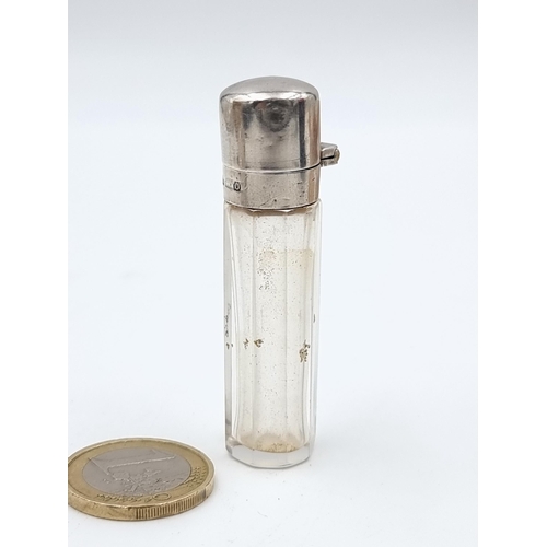 527 - An antique silver topped perfume file, set with original glass stopper. Hallmarked Birmingham, circa... 
