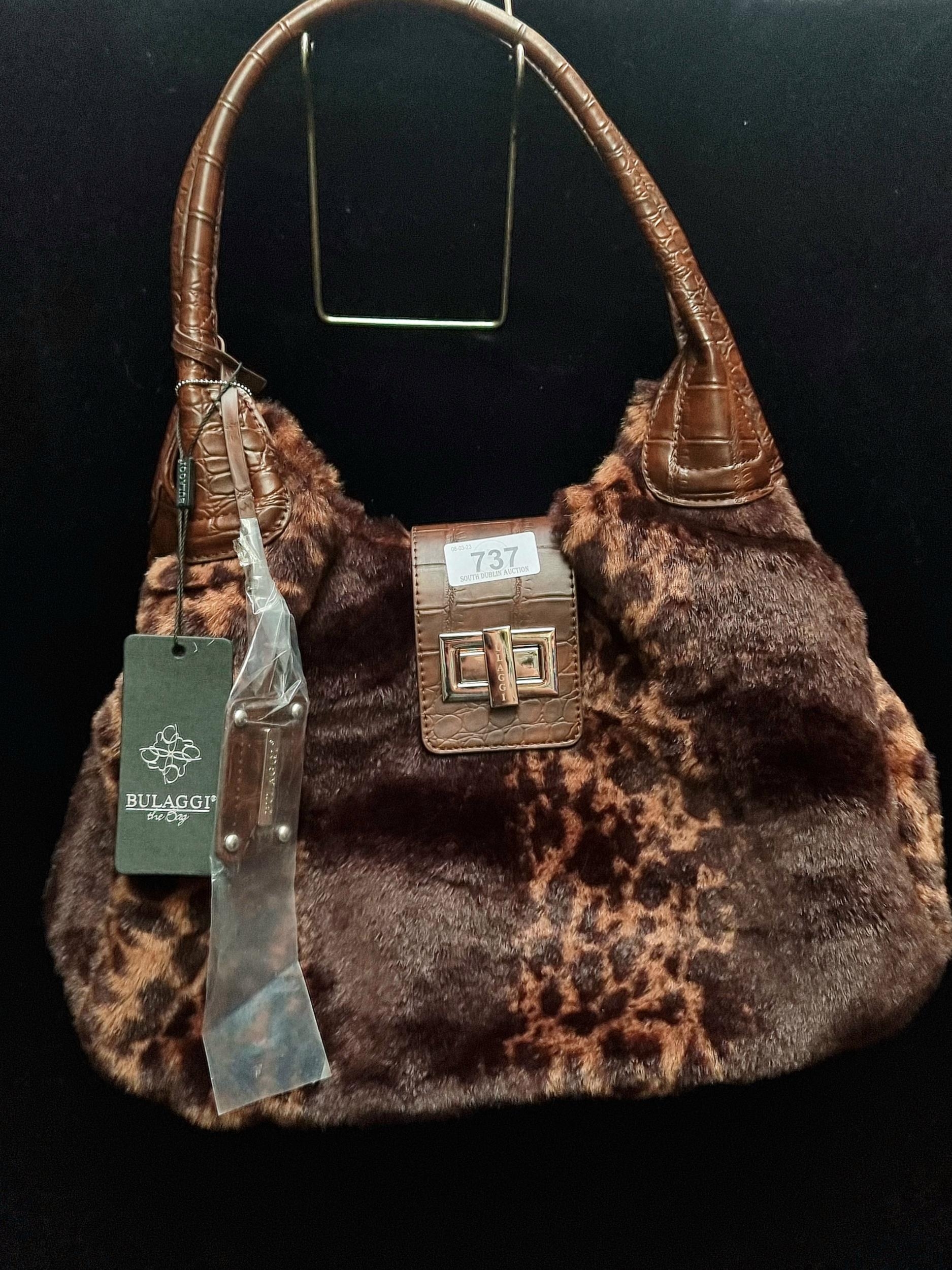 A brand new Bulaggi hand bag with faux fur elements and polished