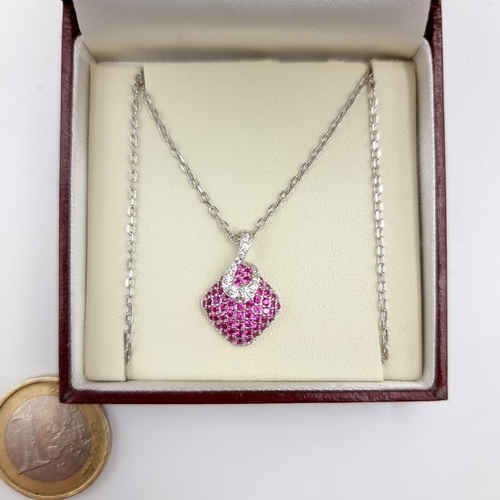 802 - A very pretty Ruby stone gem set pendant, with a sterling silver chain. Length: 44cm.