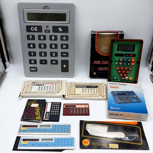 807 - A bag containing seven calculators including fun retro examples with one in the form of a pool table... 