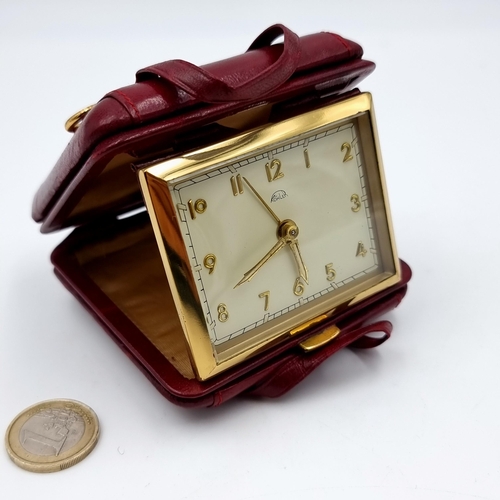 808 - A very attractive vintage travel clock by Kohler, fashioned in the form of a miniature suitcase. Cas... 