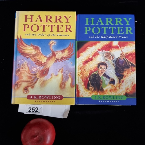 252 - Two first edition hardback Harry Potter books. Including The Order of the Phoenix and The Half Blood... 