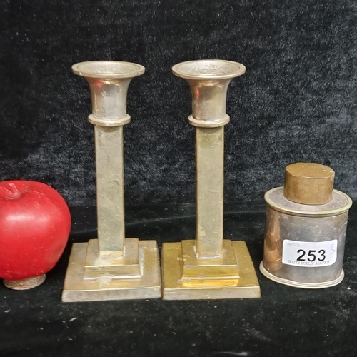 253 - Three charming vintage metal-ware items including a pair of candlesticks with square bevelled bases ... 