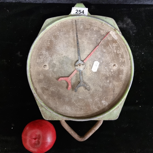 254 - An early Salter branded spring balance. To weigh 300lbs. Model number 235. Made in England with a ch... 