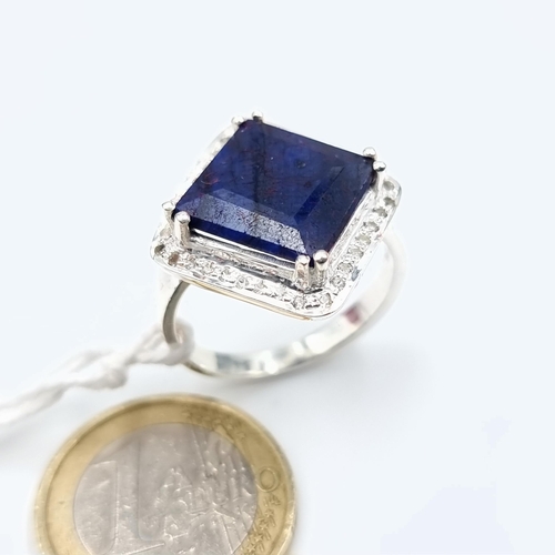 38 - An unusual Sapphire and Diamond sterling silver ring. This Sapphire is of a generous 9.2 carats and ... 
