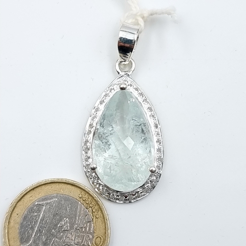 43 - A very pretty Facet cut Moonstone pear shaped sterling silver pendant, set with Diamond surround mou... 