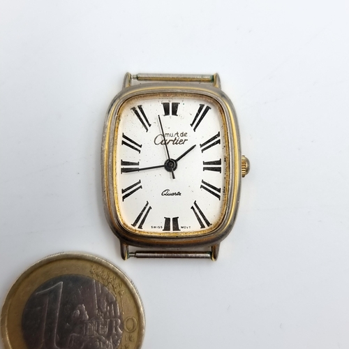 55 - A vintage Must De Cartier silver cased Quartz watch face, number: 17/050343. A handsome example. Sta... 