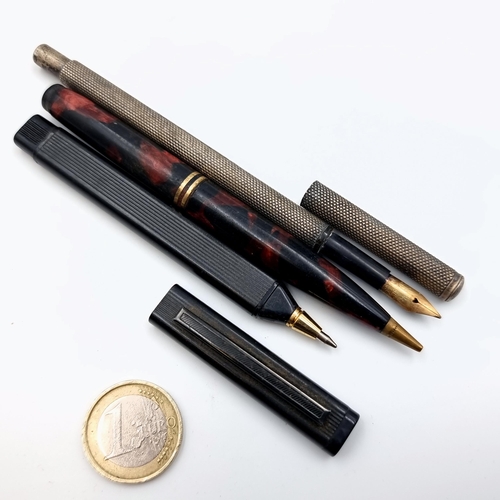 59 - A collection of three pens, consisting of a Waterman sterling silver bodied 