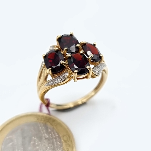 6 - Star Lot: A truly exquisite 9 carat Gold 1960's Diamond mounted four stone Garnet ring. This example... 