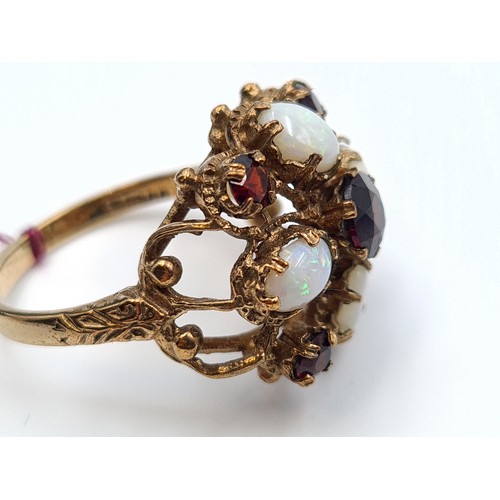 1 - Star lot : An exquisite and unusual antique 9 carat gold ring, set beautifully with Opal and Garnet ... 