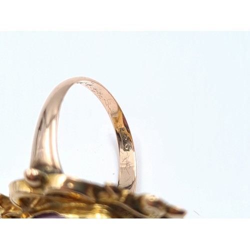 9 - A rare and beautiful example of a finely detailed 9 carat gold late-Georgian ring, set with a very l... 