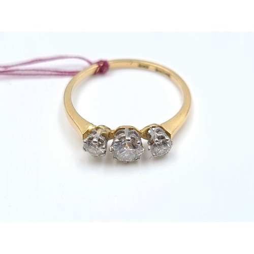 10 - Star lot : A fine example of an 18 carat antique gold three stone Diamond ring. This ring features b... 