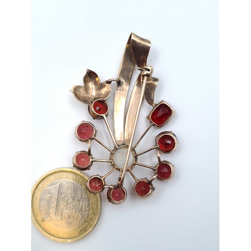 13 - Star lot : A 9 carat gold Opal set brooch, featuring a beautiful ruby surround which creates a very ... 