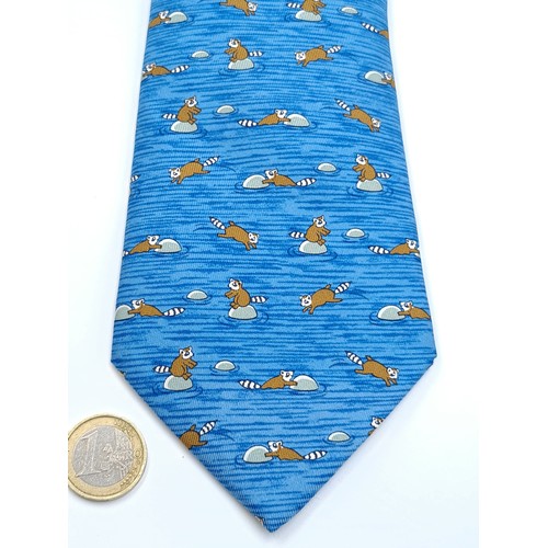 28 - A nice example of a designer authentic Hermes 100% blue silk tie, set with fun animal motif. Origina... 