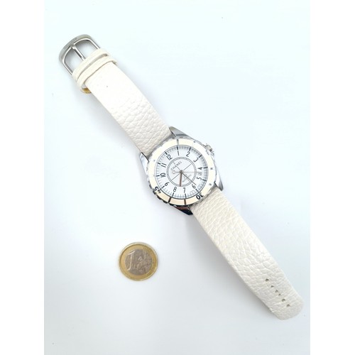 34 - Star lot : A fabulous Chanel designer automatic J12 ladies wrist watch, featuring a pretty white lea... 