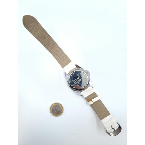 34 - Star lot : A fabulous Chanel designer automatic J12 ladies wrist watch, featuring a pretty white lea... 