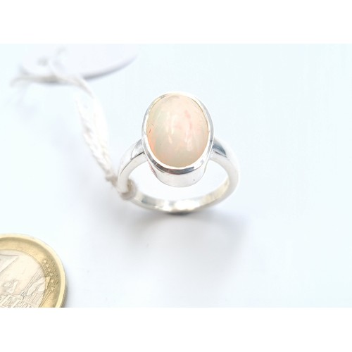 36 - A very attractive natural Fire Opal sterling silver stone ring, of 6.35 carats. Ring size: N. Weight... 