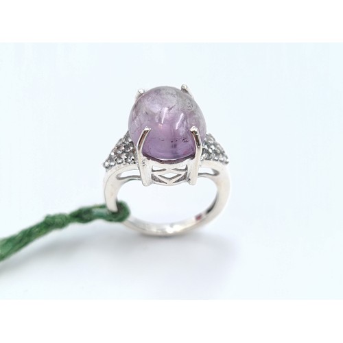 37 - A stunning example of a Simmonite and Diamond stone sterling silver ring, set with Diamond dual shou... 