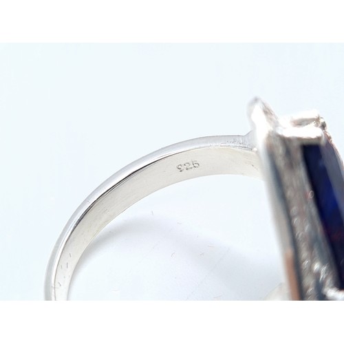 38 - An unusual Sapphire and Diamond sterling silver ring. This Sapphire is of a generous 9.2 carats and ... 
