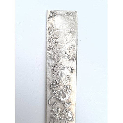 54 - A collection of two Tibetan silver Chinese bullion ingot silver scroll holders, depicting intricate ... 