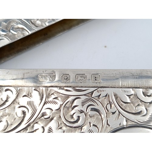 533 - An exceptional antique foliate engraved sterling silver card case, featuring a rim surround and a hi... 