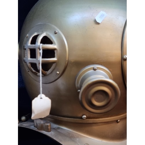 138 - Star Lot : A fabulous decorative only diver's helmet in a brass tone with glass face plate and grid.... 