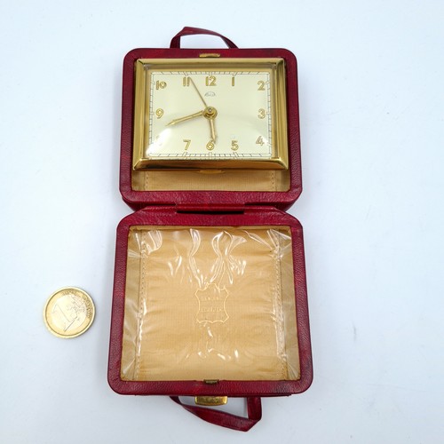 808 - A very attractive vintage travel clock by Kohler, fashioned in the form of a miniature suitcase. Cas... 