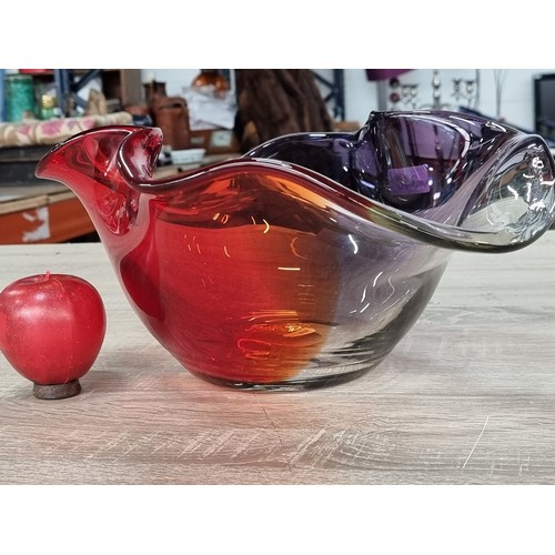 348 - A striking very large art class bowl in vibrant shades of indigo and red, featuring a dramatically f... 