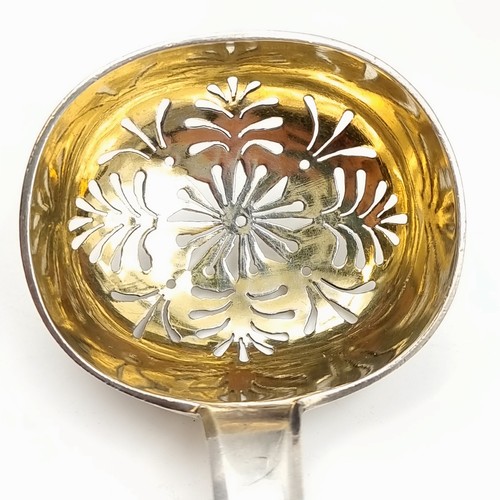 512 - Star lot : A beautiful example of an antique rare Russian silver sifting spoon, featuring stunning s... 