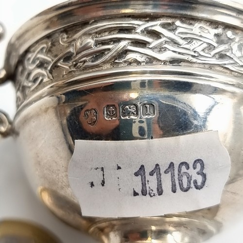 518 - A fine example of an antique sterling silver challenge cup, this cup features dual scroll handles an... 
