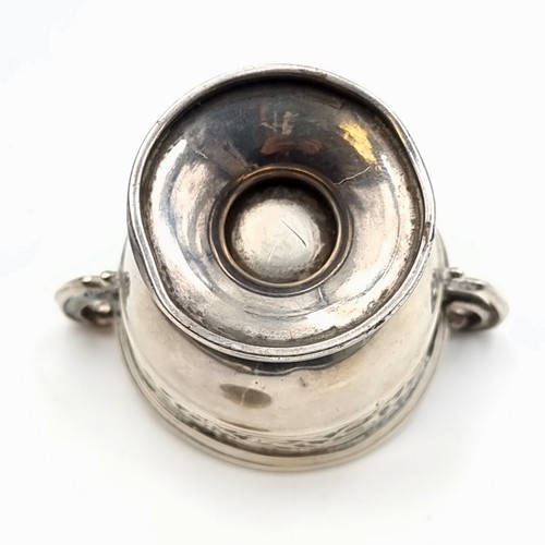 518 - A fine example of an antique sterling silver challenge cup, this cup features dual scroll handles an... 