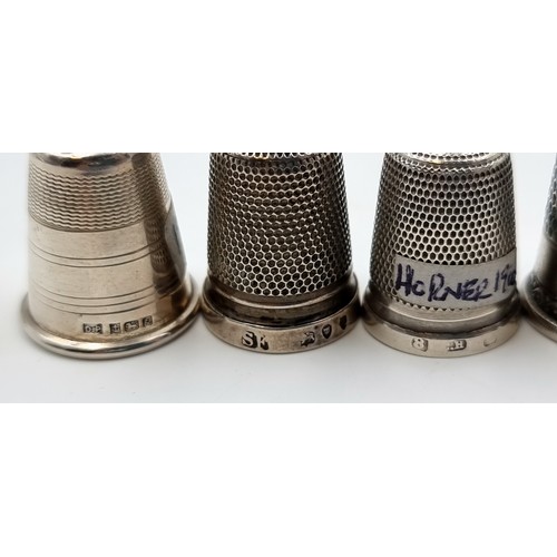 524 - A collection of six sterling silver thimbles. Of particular interest, a Thimble by the notable maker... 